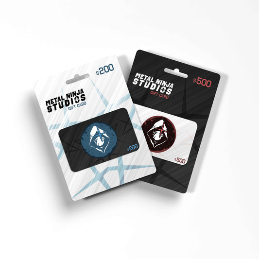 Promotional image showcasing two Metal Ninja Studios gift cards in sleek packaging. The $200 card features a white background with blue accents and the Metal Ninja Studios logo in a circular blue design, while the $500 card has a black background with red accents and the logo in a circular red design. The modern and stylish layout highlights the gift cards as perfect options for comic book enthusiasts and creative projects, emphasizing the premium branding of Metal Ninja Studios.